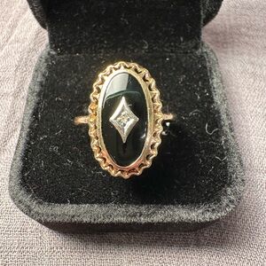 Elegant Gold and Black Ring with Diamond Accent
